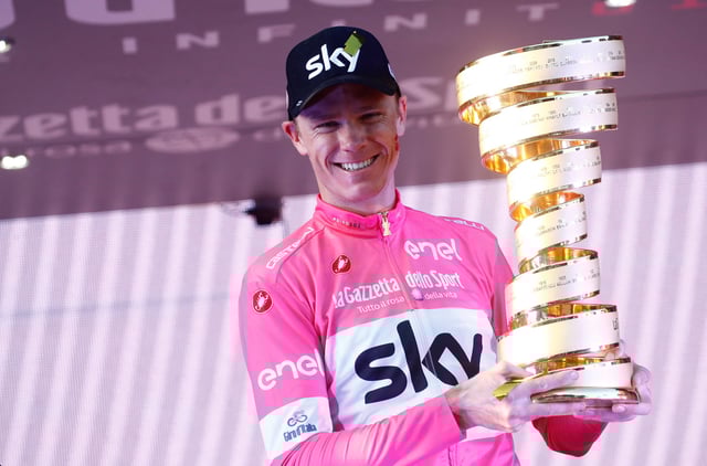 Pink jersey Britain's rider of team Sky Christopher Froome, winner, poses with the trophy on the podium after the 21st and last stage of the 101st Giro d'Italia, Tour of Italy cycling race, on May 27, 2018 in Rome. Britain's Chris Froome completed a sensational comeback to win the Giro d'Italia on Sunday for a rare Grand Tour treble after the 21st and final stage in Rome. Froome, 33, became the first Briton to win the race in the Giro's 101-year history after the 115km closed circuit race through the streets of the Italian capital. (Photo by LUK BENIES / AFP) (Photo by LUK BENIES/AFP via Getty Images)