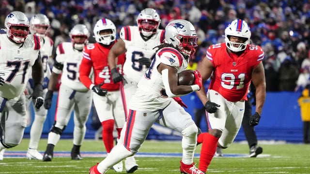 Dec 22, 2024; Orchard Park, New York, USA; New England Patriots running back Rhamondre Stevenson (38) runs with the ball against the Buffalo Bills during the second half at Highmark Stadium. Mandatory Credit: Gregory Fisher-Imagn Images