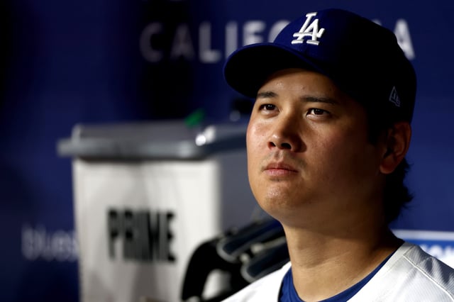 LOS ANGELES, CALIFORNIA - AUGUST 05: Shohei Ohtani #17 of the Los Angeles Dodgers looks on from the dugout during the ninth inning against the St. Louis Cardinals at Dodger Stadium on August 05, 2025 in Los Angeles, California. (Photo by Katelyn Mulcahy/Getty Images)