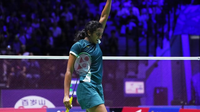 Pusarla V. Sindhu celebrates as she defeats China' s Wang Zhi Yi during their women's third round match of the Badminton World Championships