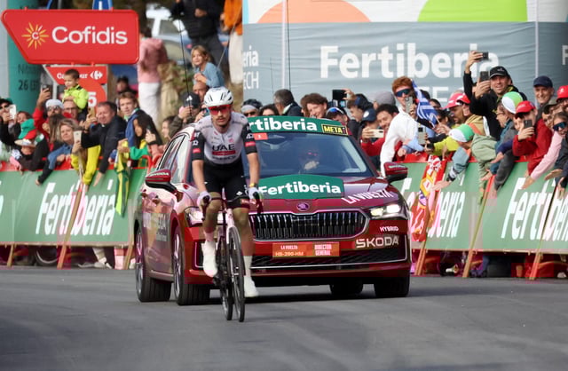 Cycling - Vuelta a Espana - Stage 6 - Olot to Pal - Olot, Andorra - August 28, 2025 UAE Team Emirates' Jay Vine in action before crossing the line to win stage 6 REUTERS/Bruna Casas