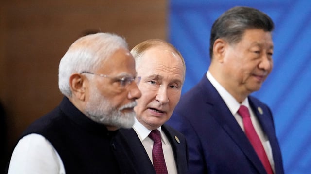 Prime Minister Narendra Modi, Russian President Vladimir Putin and Chinese President Xi Jinping attend a family photo ceremony prior to the BRICS Summit plenary session in Kazan, Russia, Wednesday, Oct. 23, 2024.