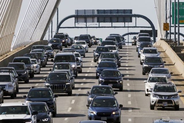 File photo: heavy traffic heads south on I-93 over the Zakim Bridge ahead of Labor Day weekend in Boston in 2023.