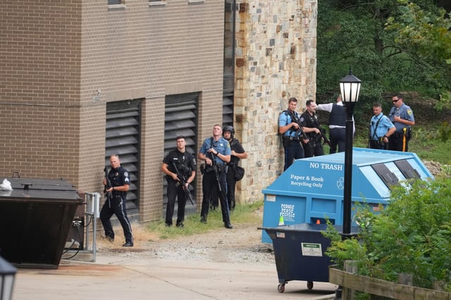 Police gather at the Villanova University campus where an active shooter was reported Thursday, Aug. 21, 2025, in Villanova, Pa. (AP Photo/Matt Slocum)