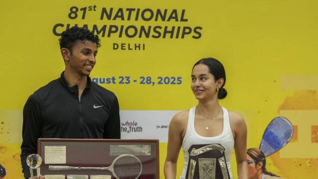 Delhi's Anahat Singh and Tamil Nadu's Velavan Senthilkumar with their trophies at the 81st National Squash Championship in New Delhi. (PTI)