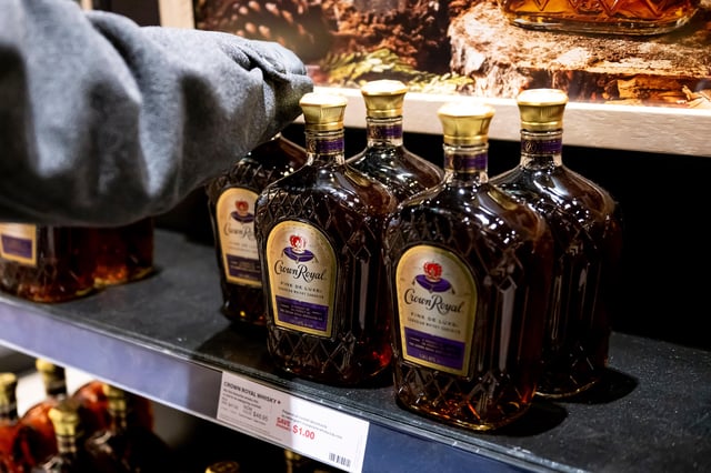 Bottles of Canadian-made Crown Royal whisky on a shelf at the Liquor Control Board of Ontario (LCBO) Queen's Quay store in Toronto, Ontario, Canada, on Tuesday, March 4, 2025. Windsor Police Service is investigating after the theft of a truckload full of $100,000 worth of liquor, after a break-in at a commercial facility earlier this month.