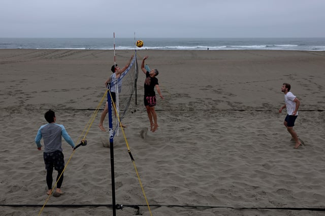 People play volleyball at Ocean Beach on July 30, 2025, in San Francisco.