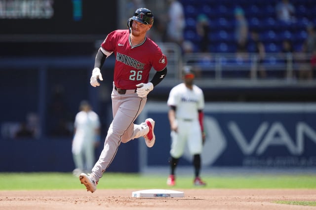 Apr 17, 2025; Miami, Florida, USA;  Arizona Diamondbacks first baseman Pavin Smith (26) rounds the bases after hitting home run in the bottom of the first inning against the Miami Marlins at loanDepot Park. Mandatory Credit: Jim Rassol-Imagn Images/File Photo