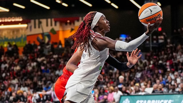 Aug 27, 2025; College Park, Georgia, USA; Atlanta Dream guard Rhyne Howard (10) shoots at the basket against the Las Vegas Aces during the second half at Gateway Center Arena at College Park. Mandatory Credit: Dale Zanine-Imagn Images