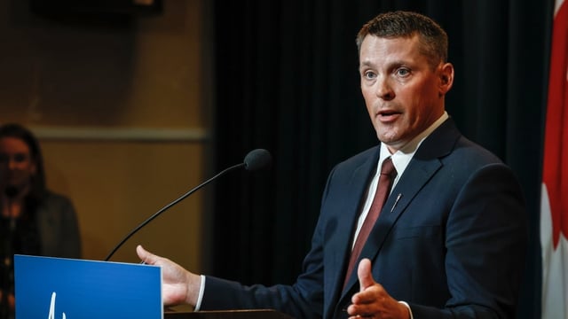 Alberta Finance Minister Nate Horner speaks to the media in a file photo from June 2023. During a fiscal update Thursday, Horner announced that Alberta will now end the fiscal year, $6.5 billion in the red. 