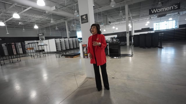 Billionaire Ruby Liu tours a former Hudson's Bay-owned Saks Off 5th department store after a "handover ceremony" where she received the keys to the space at Tsawwassen Mills shopping mall that she owns, in Tsawwassen, B.C., on Thursday, June 26, 2025. Liu was granted court approval this week to take over leases for three Hudson's Bay properties in malls she owns. THE CANADIAN PRESS/Darryl Dyck
