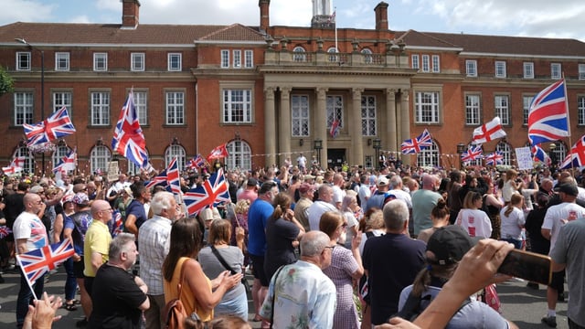 People protested outside Nuneaton & Bedworth borough council this month after the two men were claimed to be asylum seekers
