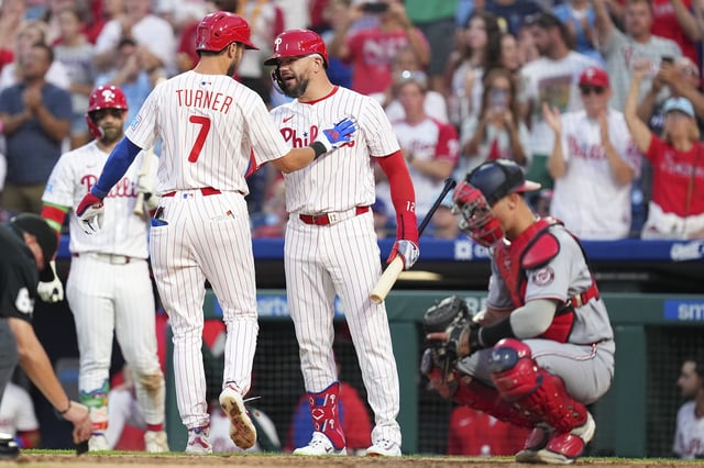 PHILADELPHIA, PENNSYLVANIA - AUGUST 23: Trea Turner #7 of the Philadelphia Phillies celebrates with Kyle Schwarber #12 after hitting a solo home run in the bottom of the fifth inning against the Washington Nationals at Citizens Bank Park on August 23, 2025 in Philadelphia, Pennsylvania. The Phillies defeated the Nationals 6-4.
