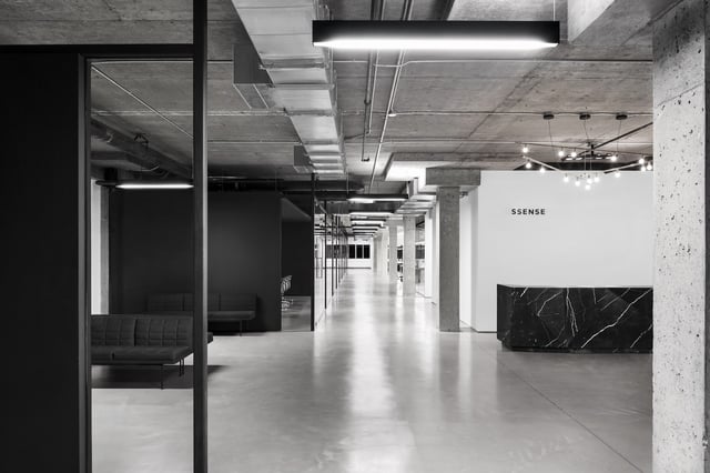 A black-and-white image of an empty office space with the word "Ssense" visible on one wall. Adrien Williams/Handout