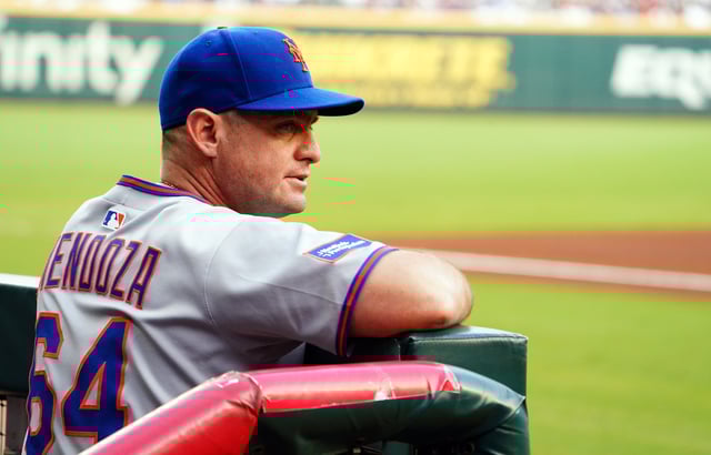 ATLANTA, GEORGIA - AUGUST 23: Carlos Mendoza #64 of the New York Mets looks on from the dugout against the Atlanta Braves during the first inning at Truist Park on August 23, 2025 in Atlanta, Georgia. (Photo by John David Mercer/Getty Images)