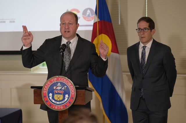 Colorado Gov. Jared Polis, left, and Mark Ferrandino, the director of the Office of State Planning and Budgeting, answer questions from the media after Polis signed bills from a special legislative session and issued an order to close a budget deficit caused by the federal tax bill at the Governor's Residence at the Boettcher Mansion in Denver on Thursday, Aug. 28, 2025. (Photo by Hyoung Chang/The Denver Post)