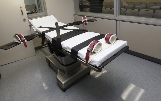 In this Thursday, Oct. 9, 2014 photo, the gurney in the the execution chamber at the Oklahoma State Penitentiary is pictured in McAlester, Okla. Oklahoma plans to resume executions Thursday, Jan. 15, 2015, after botching its last one and will use the same three-drug method as a Florida lethal injection scheduled for the same day.