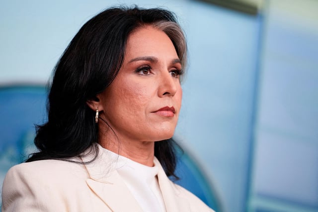 Director of National Intelligence Tulsi Gabbard looks on during a press briefing at the White House on July 23, 2025.