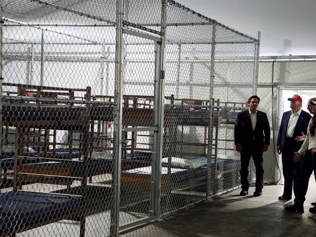 President Donald Trump tours "Alligator Alcatraz," a new migrant detention facility at Dade-Collier Training and Transition facility, Tuesday, July 1, 2025, in Ochopee, Fla. (AP Photo/Evan Vucci)