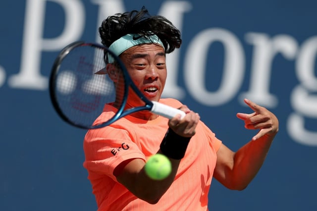 Coleman Wong makes a return during his second round US Open victory over Australia's Adam Walton