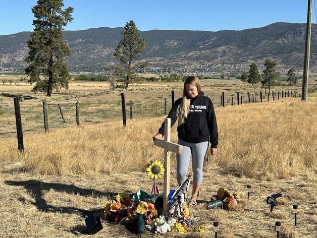  Alix Legouffe stands by a roadside memorial to her brother Buddy Rhodes, who was killed in a hit-and-run. Rhodes’ body was found off the side of the Coquihalla Highway near Exit 286 in Merritt on Aug. 30, 2024.