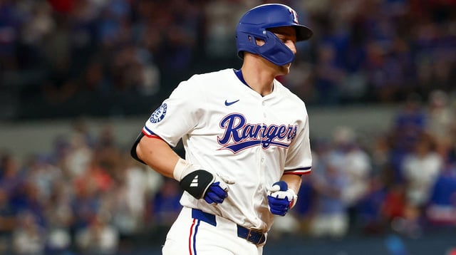Aug 26, 2025; Arlington, Texas, USA; Texas Rangers shortstop Corey Seager (5) rounds the bases after hitting a home run during the seventh inning against the Los Angeles Angels at Globe Life Field. Mandatory Credit: Kevin Jairaj-Imagn Images