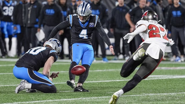 Dec 1, 2024; Charlotte, North Carolina, USA; Carolina Panthers place kicker Eddy Pineiro (4) kicks a field goal against the Tampa Bay Buccaneers during the second quarter at Bank of America Stadium. Mandatory Credit: Jim Dedmon-Imagn Images