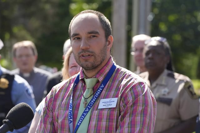 Annunciation Catholic School Principal Matt DeBoer, a graduate of Elgin's St. Edward Central Catholic High School, speaks outside the Minneapolis school following a shooting Wednesday in which students and others attending a back-to-school Mass were killed and injured. (Bruce Kluckhohn/AP)