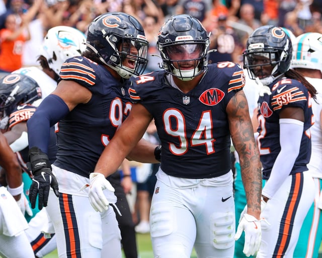 Bears defensive end Austin Booker celebrates his third sack of a preseason game against the Dolphins on Aug. 10, 2025, at Soldier Field. (Stacey Wescott/Chicago Tribune)