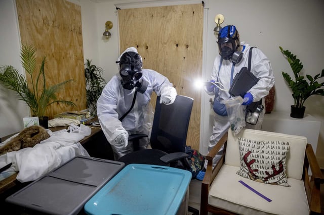 Athira Satheesh, left, and Dawn Bolstad-Johnson collect samples for testing inside a home that survived the Eaton Fire in Altadena.