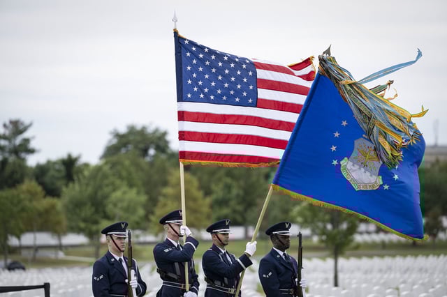 A U.S. Air Force Honor Guard conduct military funeral honors at Arlington National Cemetery.