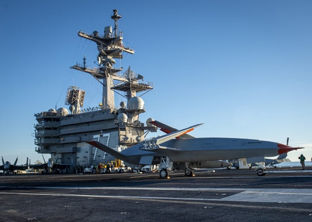 The MQ-25 Stingray test asset, T-1, conducts deck handling maneuvers on Dec. 12, 2021 while underway aboard USS George H.W. Bush (CVN-77), the first testing of the MQ-25 model at sea. (Photo: U.S. Navy)