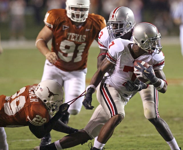 The Longhorn's Ryan Palmer can only get a grip on the wrist band of Ohio State's Ted Ginn, Jr. in the second half Saturday, Sept. 9, 2006, at Memorial Stadium in Austin. For the first time since the Longhorns' loss to the Buckeyes to open the 2006 season, there will be a matchup between teams ranked No. 3 or higher in the first month of the season when Texas and Ohio State meet Saturday.