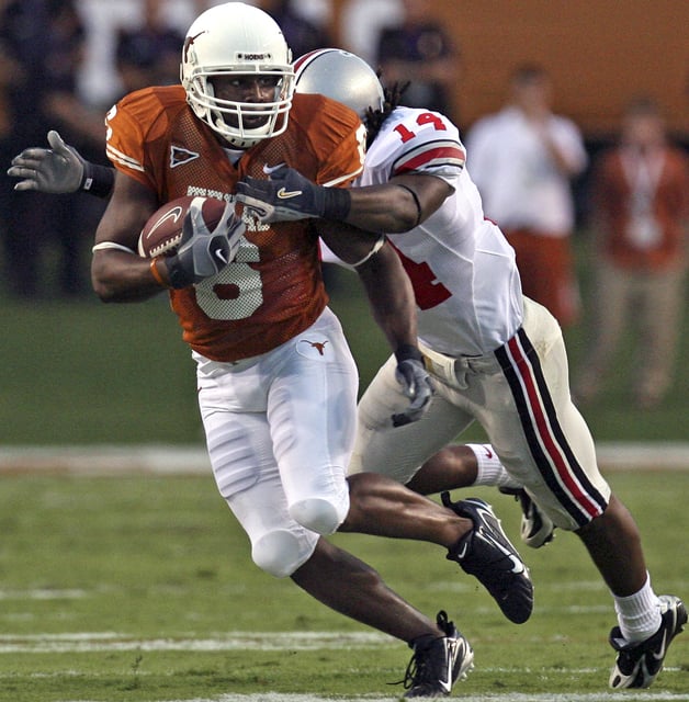UT's Quan Cosby makes a move on Ohio State's Antonio Smith after a reception in the first half Saturday, Sept. 9, 2006, in Austin. For the first time since the Longhorns' loss to the Buckeyes to open the 2006 season, there will be a matchup between teams ranked No. 3 or higher in the first month of the season when Texas and Ohio State meet Saturday.