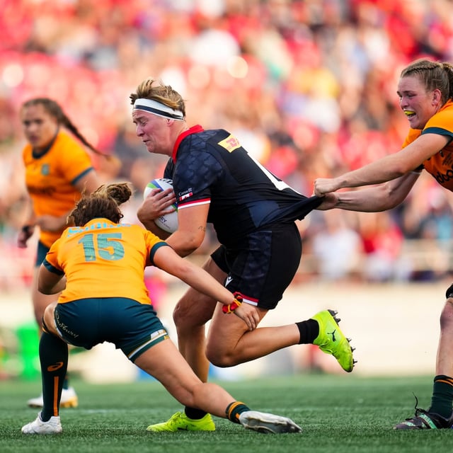 Canada's Tyson Beukeboom (4) is tackled as they take on Australia during first half rugby action at the Pacific Four Series in Ottawa on July 14, 2023. THE CANADIAN PRESS/Sean Kilpatrick