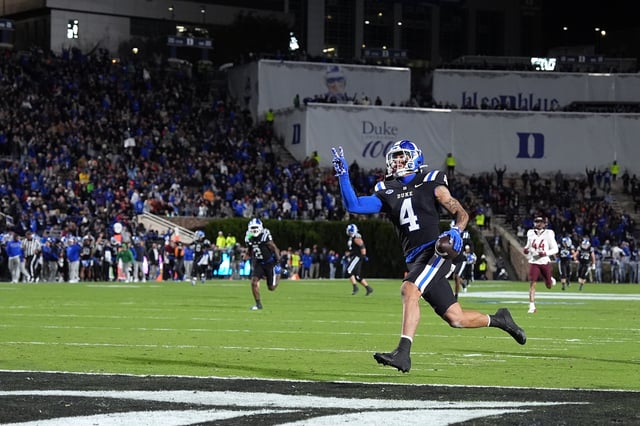 Eli Pancol #4 of the Duke Blue Devils scores his second touchdown during the first half of the game against the Virginia Tech Hokies at Wallace Wade Stadium on November 23, 2024 in Durham, North Carolina.