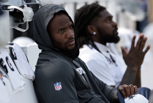 INGLEWOOD, CALIFORNIA - AUGUST 09: Micah Parsons #11 of the Dallas Cowboys sits on the sidelines in the first half of a NFL Preseason 2025 game against the Los Angeles Rams at SoFi Stadium on August 09, 2025 in Inglewood, California. (Photo by Ronald Martinez/Getty Images)