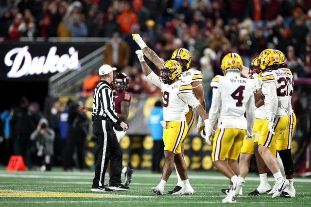 Devon Williams #9 of the Minnesota Golden Gophers celebrates with his teammates following a play during the first half of the Duke's Mayo Bowl against the Virginia Tech Hokies at Bank of America Stadium on January 03, 2025 in Charlotte, North Carolina.
