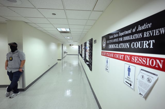 Federal agents patrol the halls of immigration court at the Jacob K. Javitz Federal Building on August 28, 2025 in New York City.