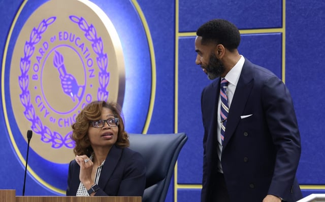 Macquline King, interim superintendent of Chicago Public Schools, is greeted by Chicago Public Schools Board of Education President Sean Harden before a board meeting at CPS headquarters on Aug. 28, 2025. (John J. Kim/Chicago Tribune)