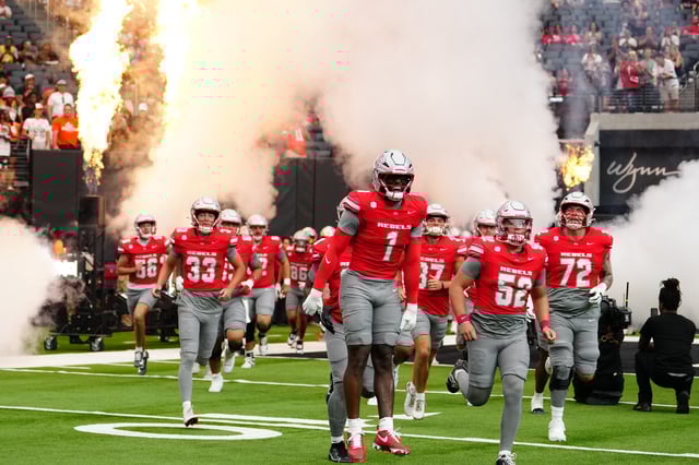 Alex Orji #1 of the UNLV Rebels leads the team out of the tunnel for the start of a game against the Idaho State Bengals at Allegiant Stadium on August 23, 2025 in Las Vegas, Nevada.