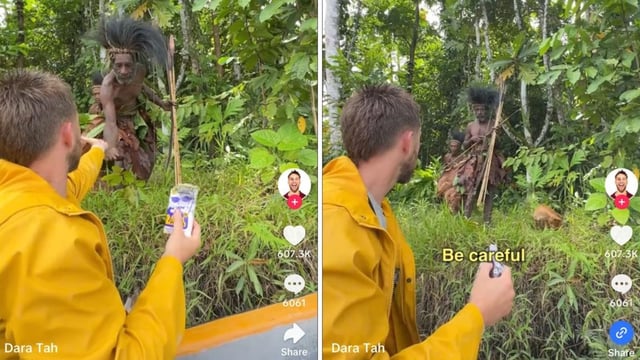 Irish YouTuber Dara Tah offering salt to a member of a cannibal tribe in Papua. 