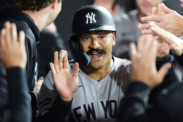 New York Yankees' Trent Grisham celebrates with teammates after hitting a two-run home run during the eighth inning of a baseball game against the Chicago White Sox in Chicago, Thursday, Aug. 28, 2025. (AP Photo/Nam Y. Huh)