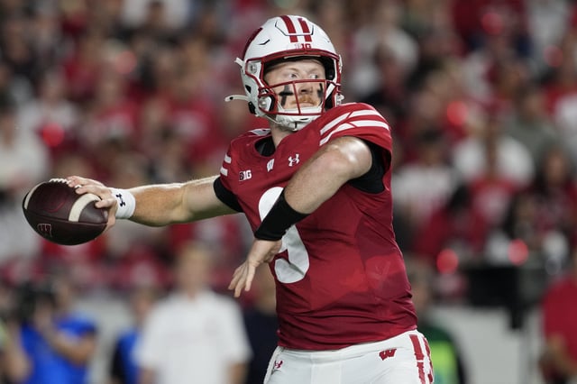 Aug 28, 2025; Madison, Wisconsin, USA;  Wisconsin Badgers quarterback Billy Edwards Jr. (9) throws a pass during the second quarter against the Miami (OH) RedHawks at Camp Randall Stadium. Mandatory Credit: Jeff Hanisch-Imagn Images