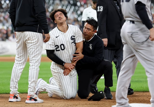 Chicago White Sox first baseman Miguel Vargas receives medical attention after suffering an injury in the fifth inning of a game against the New York Yankees at Rate Field in Chicago on Aug. 28, 2025.  (Chris Sweda/Chicago Tribune)