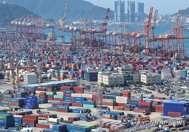 Containers await shipment overseas at a port in the southeastern city of Busan, in this July 31, 2025, file photo. (Yonhap)