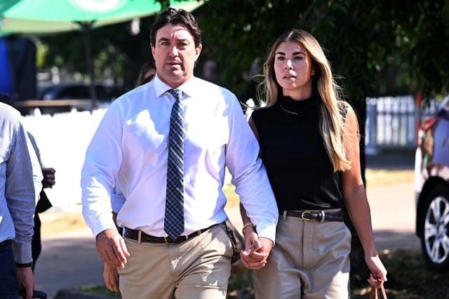 Matt Wright (L), the star of the series "Wild Croc Territory" and "Outback Wrangler", arrives with his wife Kaia Wright (R) at the Supreme Court in Darwin on August 12, 2025