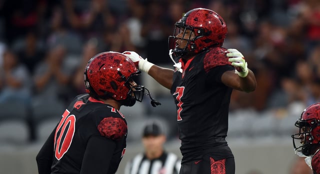 SAN DIEGO, CA – AUGUST 28: San Diego State Aztecs running back Lucky Sutton (7) celebrates with San Diego State Aztecs offensive lineman Christian Jones (70) after scoring a touchdown during the college football game between the Stony Brook Seawolves and the San Diego State Aztecs on August 28, 2025, at Snapdragon Stadium in San Diego, CA. (Photo by Chris Williams/Icon Sportswire via Getty Images)