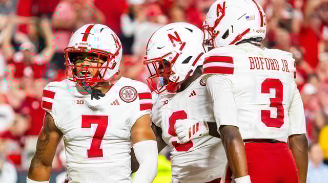 Aug 28, 2025; Kansas City, Missouri, USA; Nebraska Cornhuskers defensive back Malcolm Hartzog Jr. (7) celebrates with linebacker Vincent Shavers Jr. (9) and defensive back Marques Buford Jr. (3) after an interception against the Cincinnati Bearcats during the fourth quarter at GEHA Field at Arrowhead Stadium. Mandatory Credit: Dylan Widger-Imagn Images