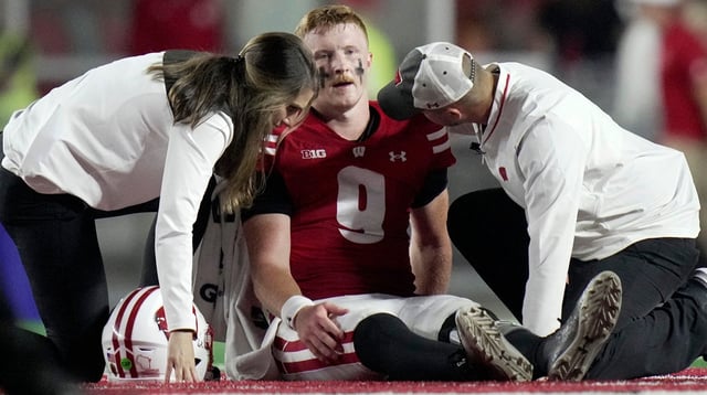 Wisconsin quarterback Billy Edwards Jr. (9) is tended to after being injured during the second quarter of their game against Miami (Ohio) Thursday, August 28, 2025 at Camp Randall Stadium in Madison, Wisconsin.